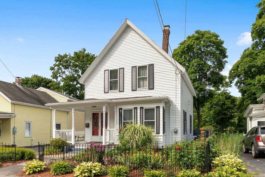 66 Manning Street Hudson, MA 01749 - Photo 35 of 40 a view of a white house next to a yard