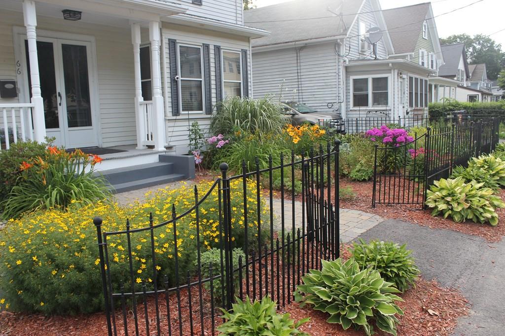 66 Manning Street Hudson, MA 01749 - Photo 37 of 40 a view of a house with a flower garden