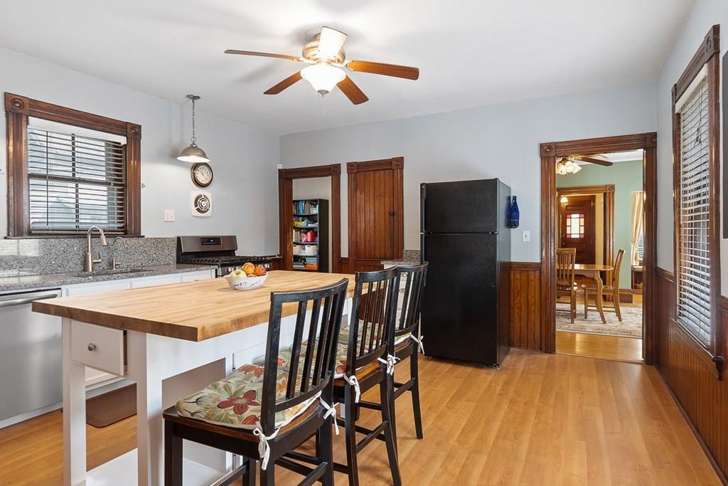 66 Manning Street Hudson, MA 01749 - Photo 4 of 40 a view of a dining room with furniture and wooden floor