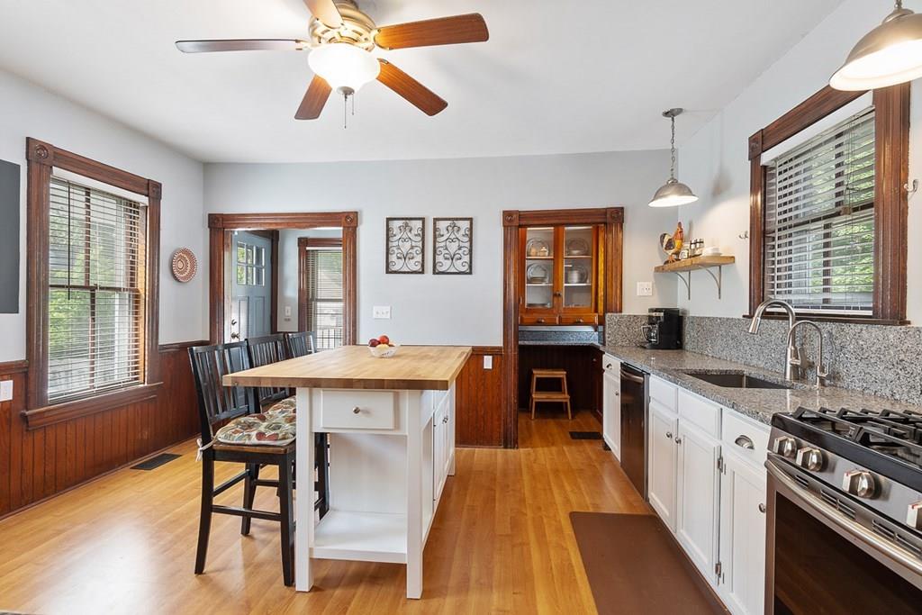 66 Manning Street Hudson, MA 01749 - Photo 6 of 40 a large kitchen with a table and chairs