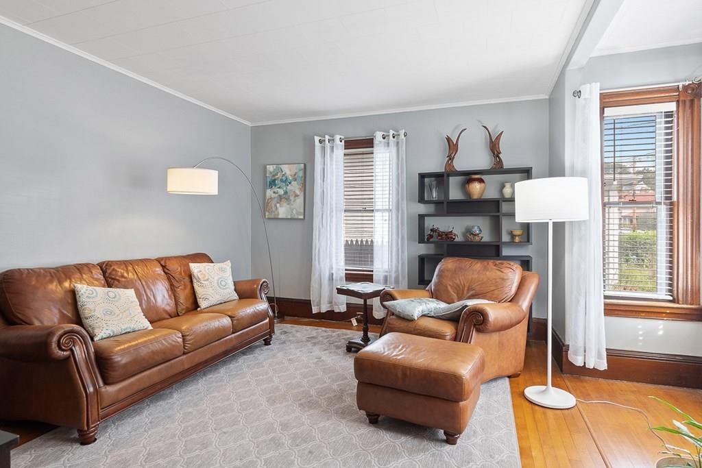 66 Manning Street Hudson, MA 01749 - Photo 9 of 40 a living room with furniture and a fireplace