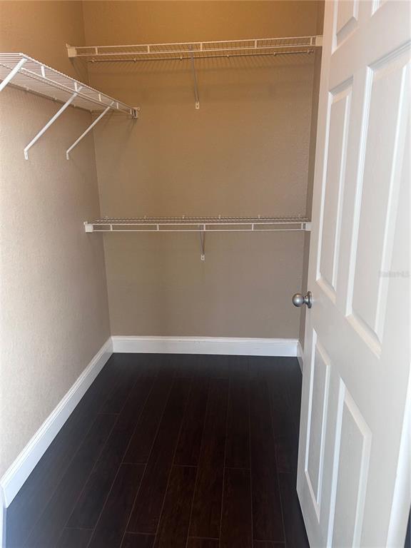 8213 Claire Ann Drive, Unit 203 Orlando, FL 32825 - Photo 9 of 9 an empty room with wooden floor