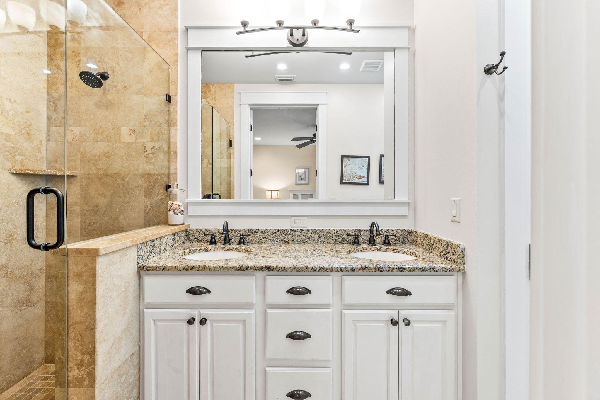 17 Red Basil Drive Santa Rosa Beach, FL 32459 - Photo 27 of 59 a bathroom with a granite countertop sink a mirror a vanity and a shower
