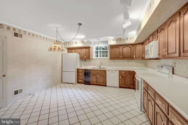 a bathroom with a sink a mirror and a shower
