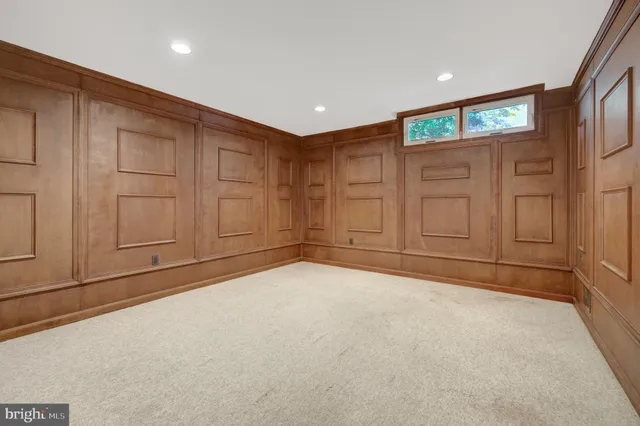 a bathroom with a granite countertop toilet and a sink