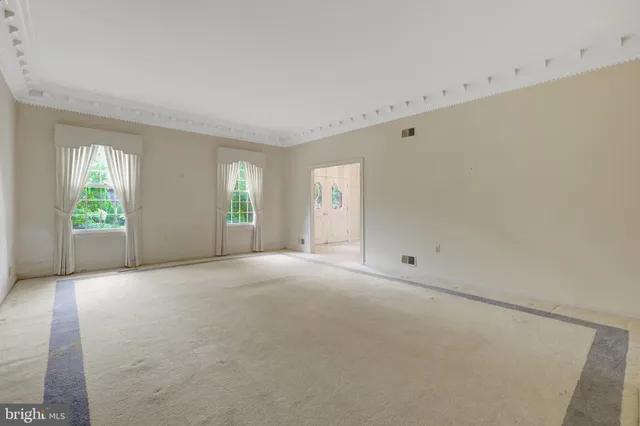 an empty room with windows