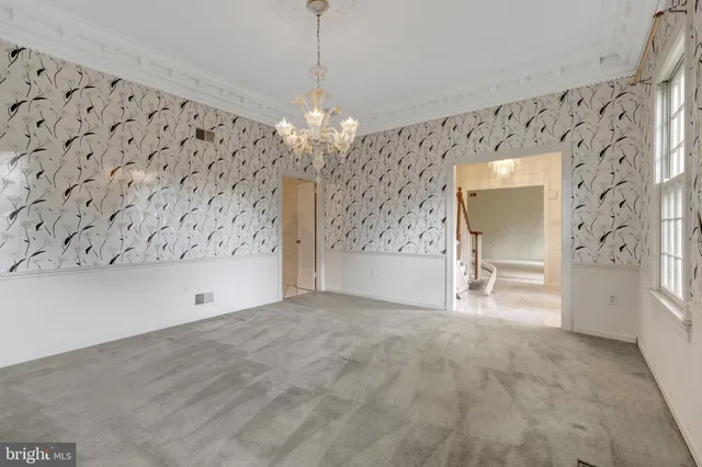 a large kitchen with cabinets and stainless steel appliances
