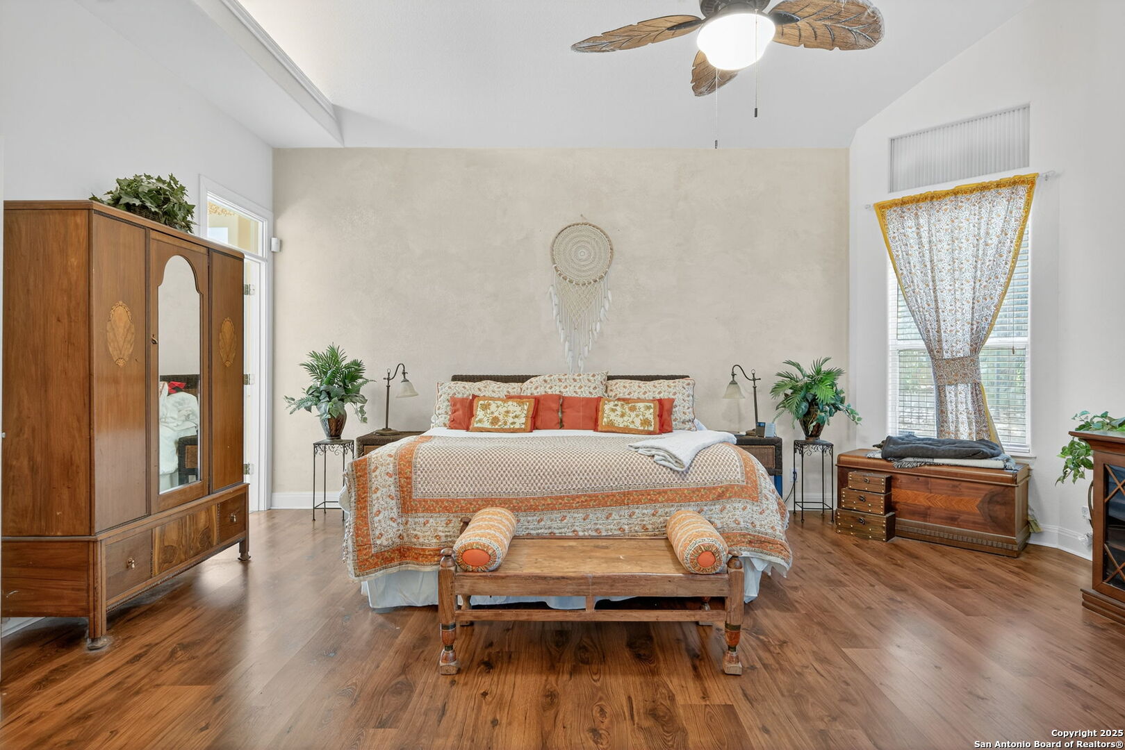 29019 Tivoli Way Fair Oaks Ranch, TX 78015 - Photo 17 of 33 a bedroom with wooden floor and large windows