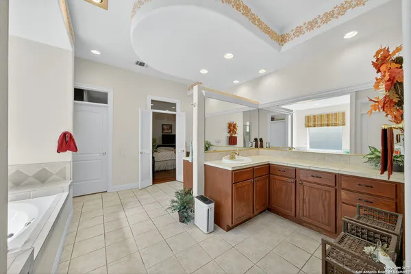 a large kitchen with stainless steel appliances lots of counter top space