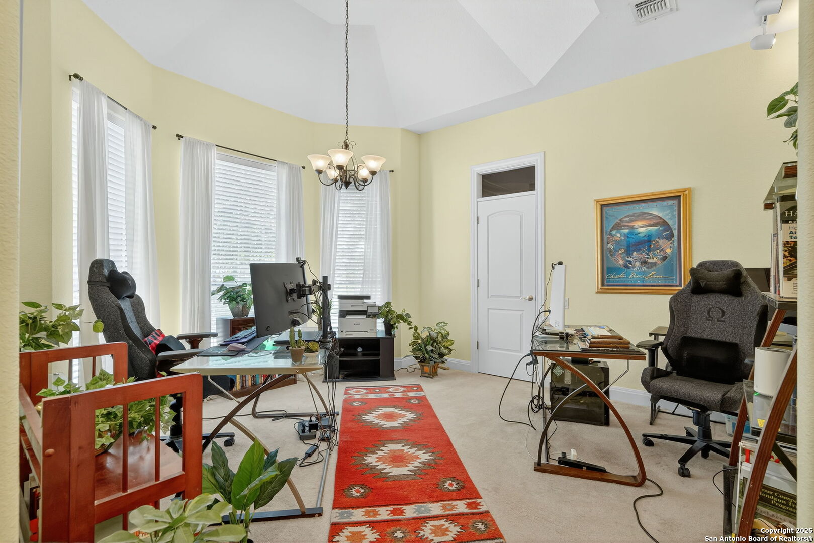29019 Tivoli Way Fair Oaks Ranch, TX 78015 - Photo 25 of 33 a living room with furniture a rug and a chandelier
