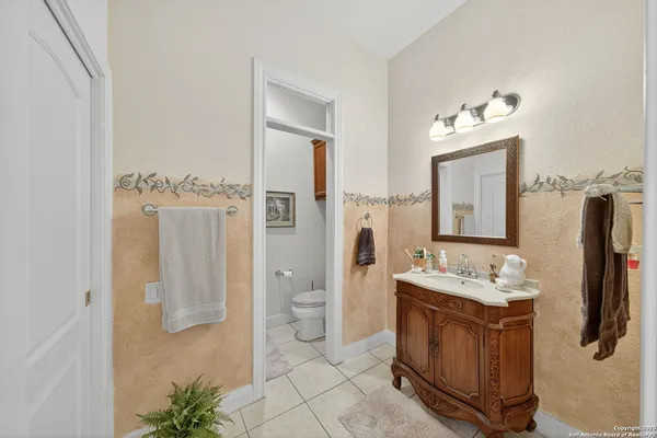 a spacious bathroom with a double vanity sink and a mirror