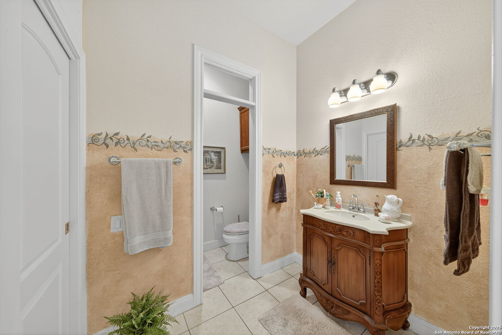 29019 Tivoli Way Fair Oaks Ranch, TX 78015 - Photo 26 of 33 a spacious bathroom with a double vanity sink and a mirror