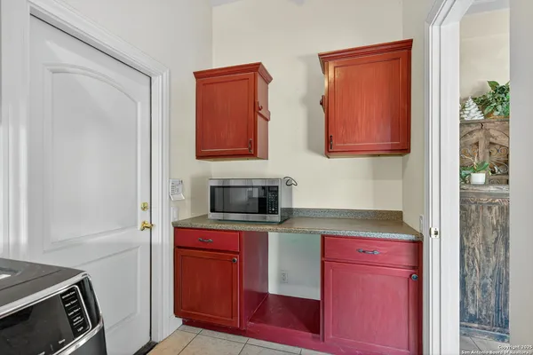 a kitchen with stainless steel appliances granite countertop a stove and a microwave