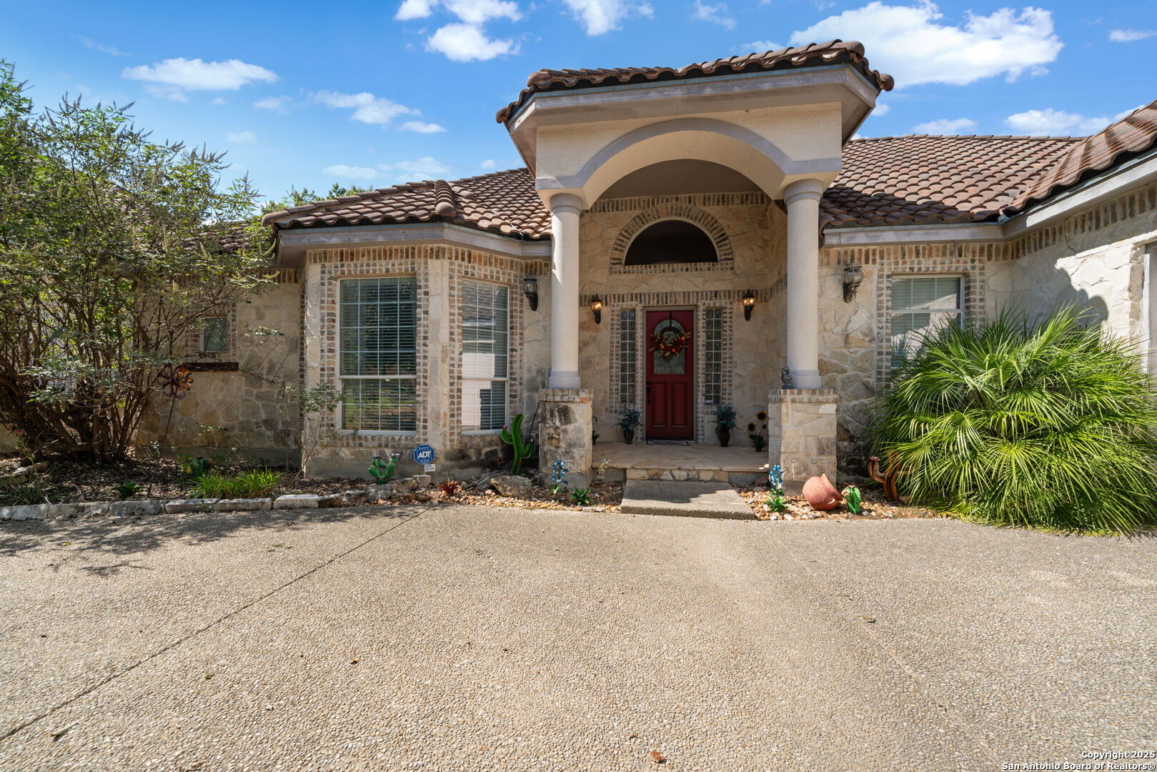 29019 Tivoli Way Fair Oaks Ranch, TX 78015 - Photo 3 of 33 a front view of a house with garden