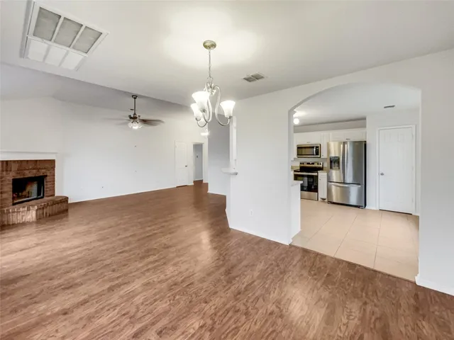 a view of a kitchen with a sink and a kitchen counter top space