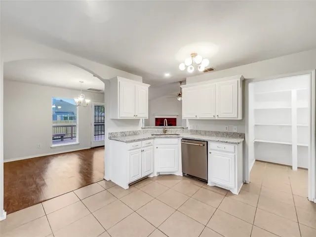 a kitchen with a sink and cabinets
