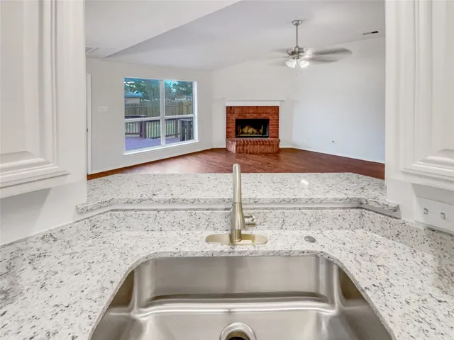 a kitchen with a sink and a window