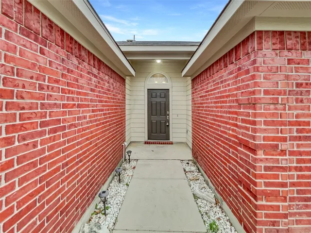 a entryway with brick walls