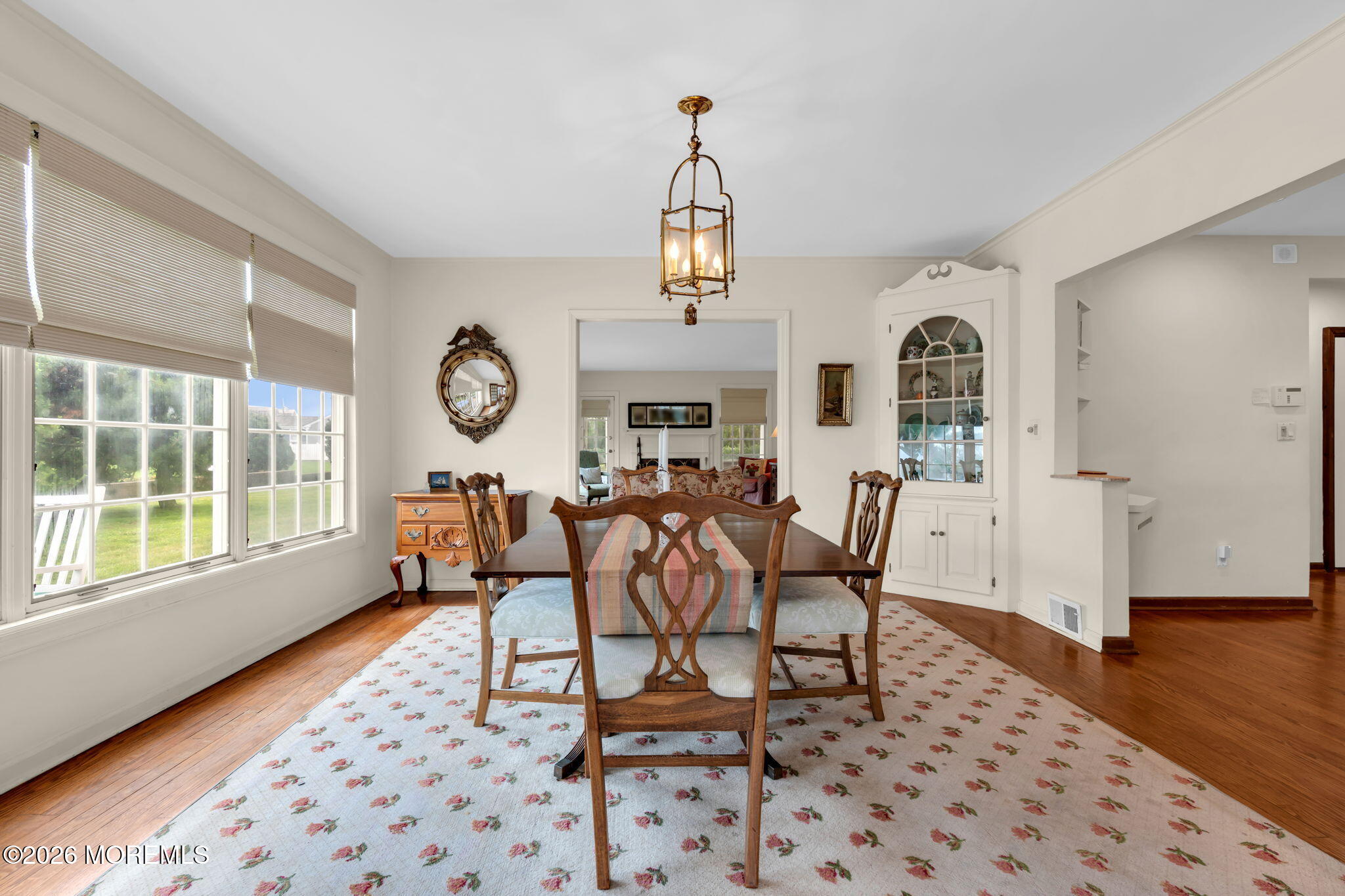 5 Howell Avenue Spring Lake, NJ 07762 - Photo 22 of 92 a dining room with wooden floor a glass table and chairs
