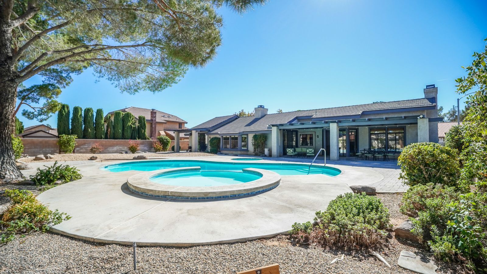 948 Hermosa Avenue Ridgecrest, CA 93555 - Photo 42 of 46 a view of a swimming pool with a garden