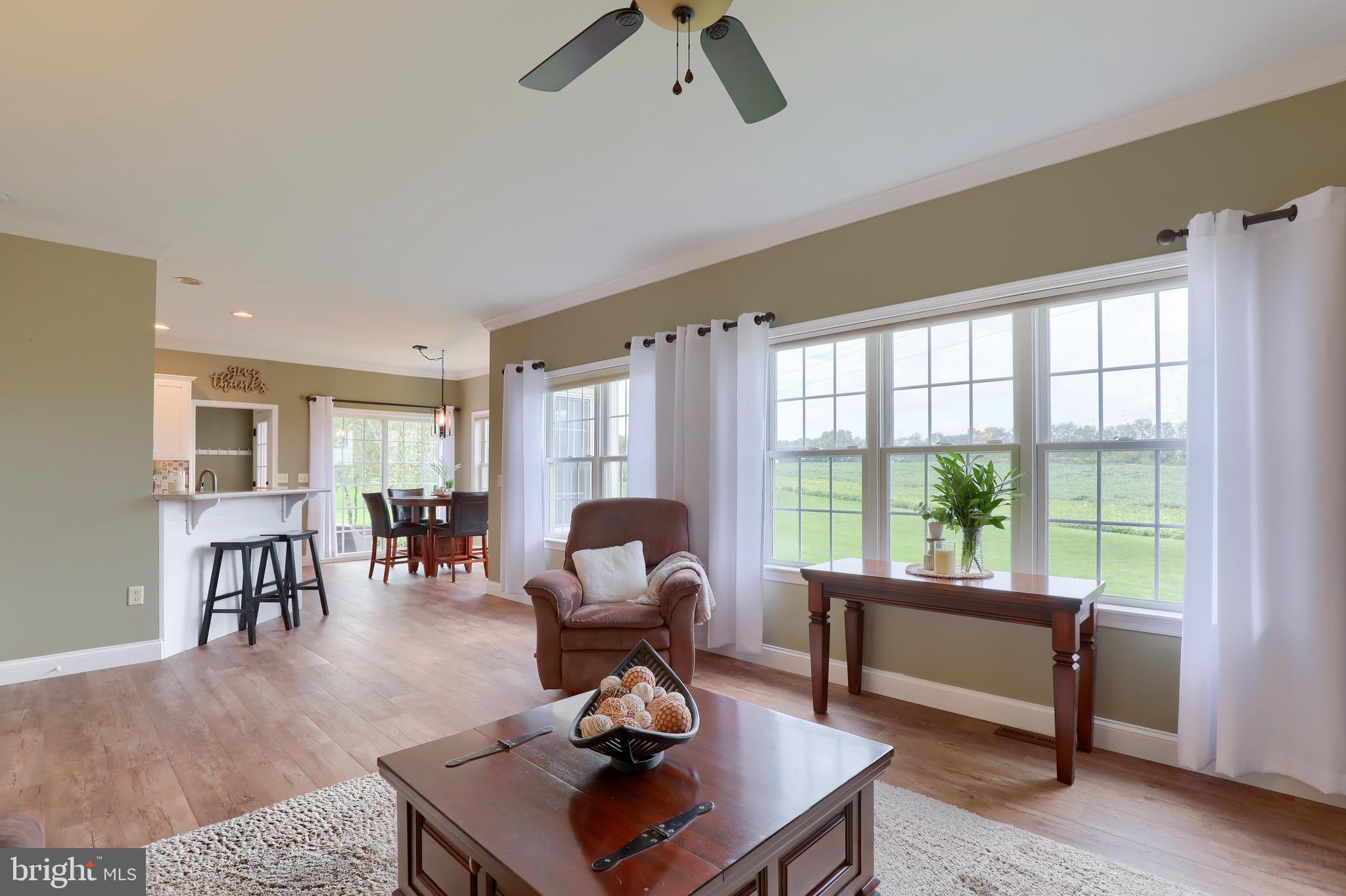 409 Wagonwheel Road Lititz, PA 17543 - Photo 12 of 40 a living room with furniture a rug and a floor to ceiling window