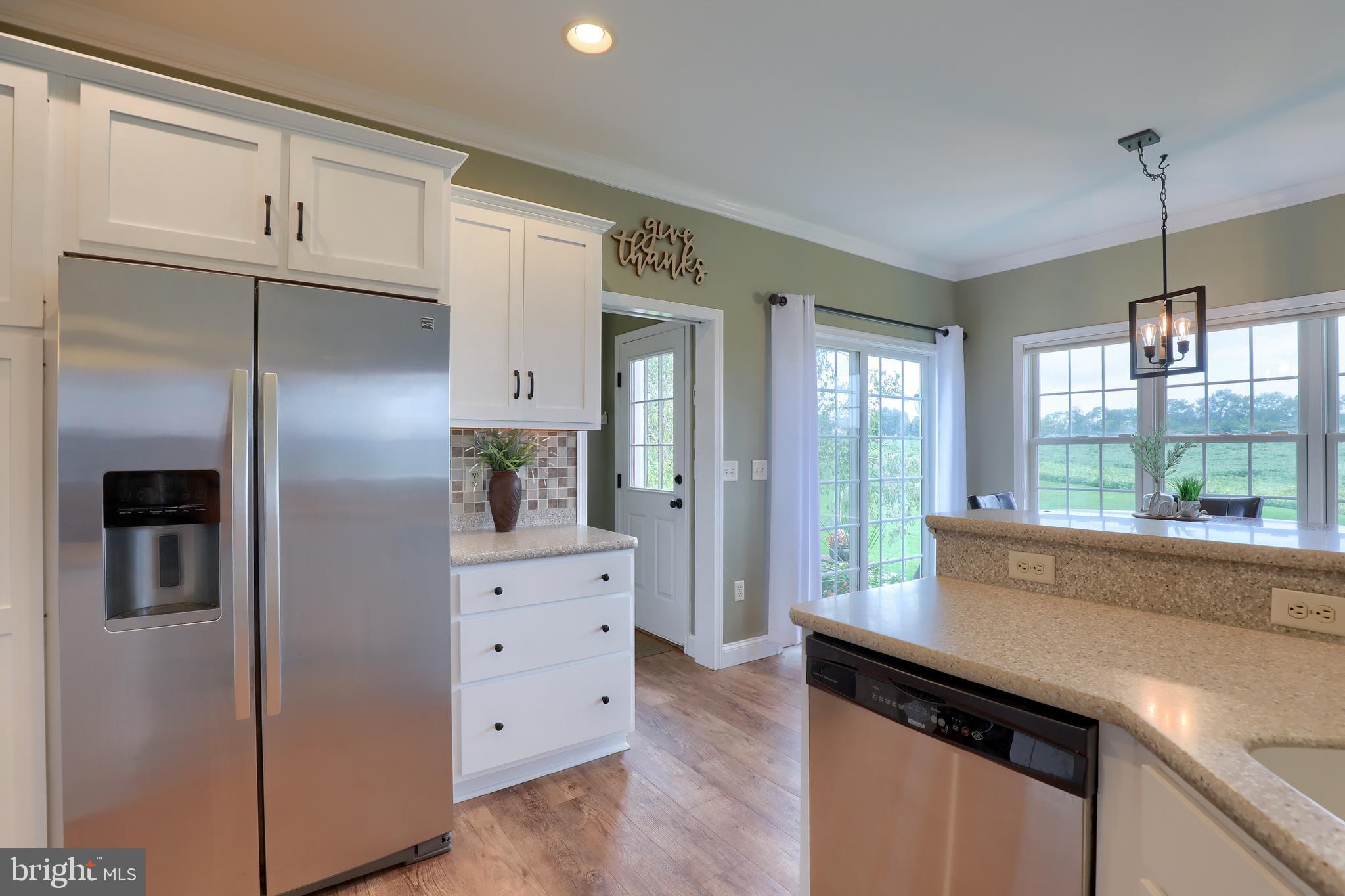 409 Wagonwheel Road Lititz, PA 17543 - Photo 17 of 40 a kitchen with stainless steel appliances granite countertop a refrigerator and a sink