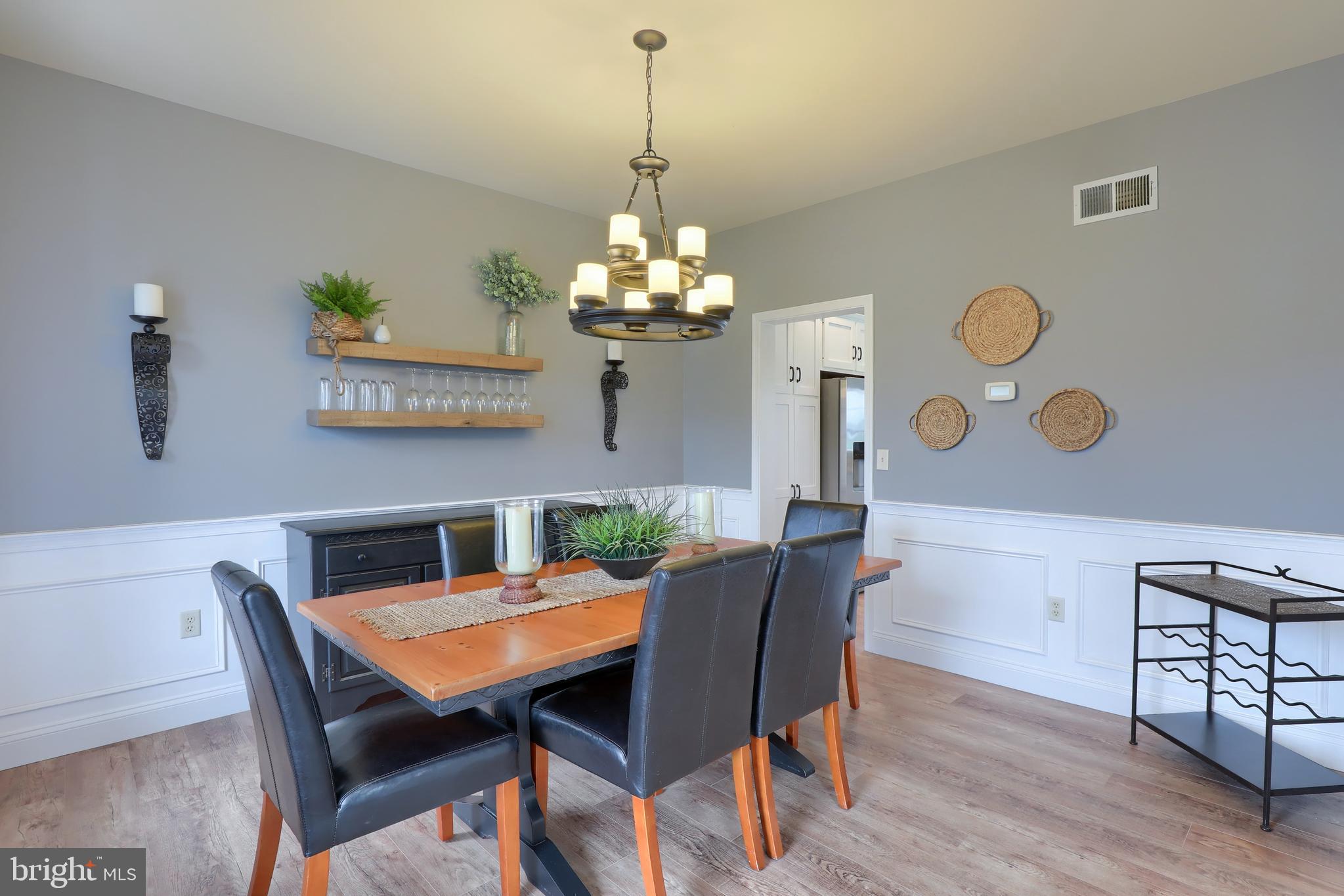 409 Wagonwheel Road Lititz, PA 17543 - Photo 19 of 40 a view of a dining room with furniture and chandelier