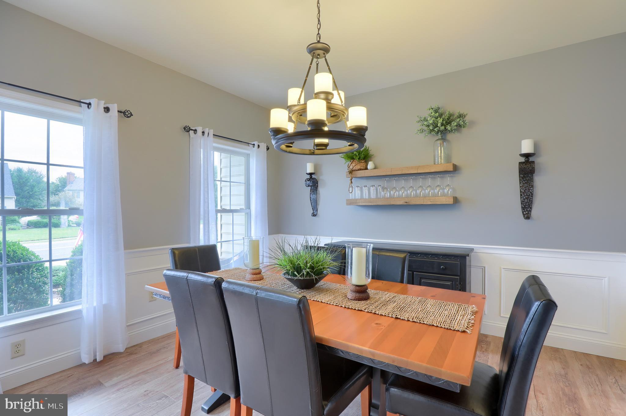 409 Wagonwheel Road Lititz, PA 17543 - Photo 20 of 40 a dining room with furniture a chandelier and wooden floor