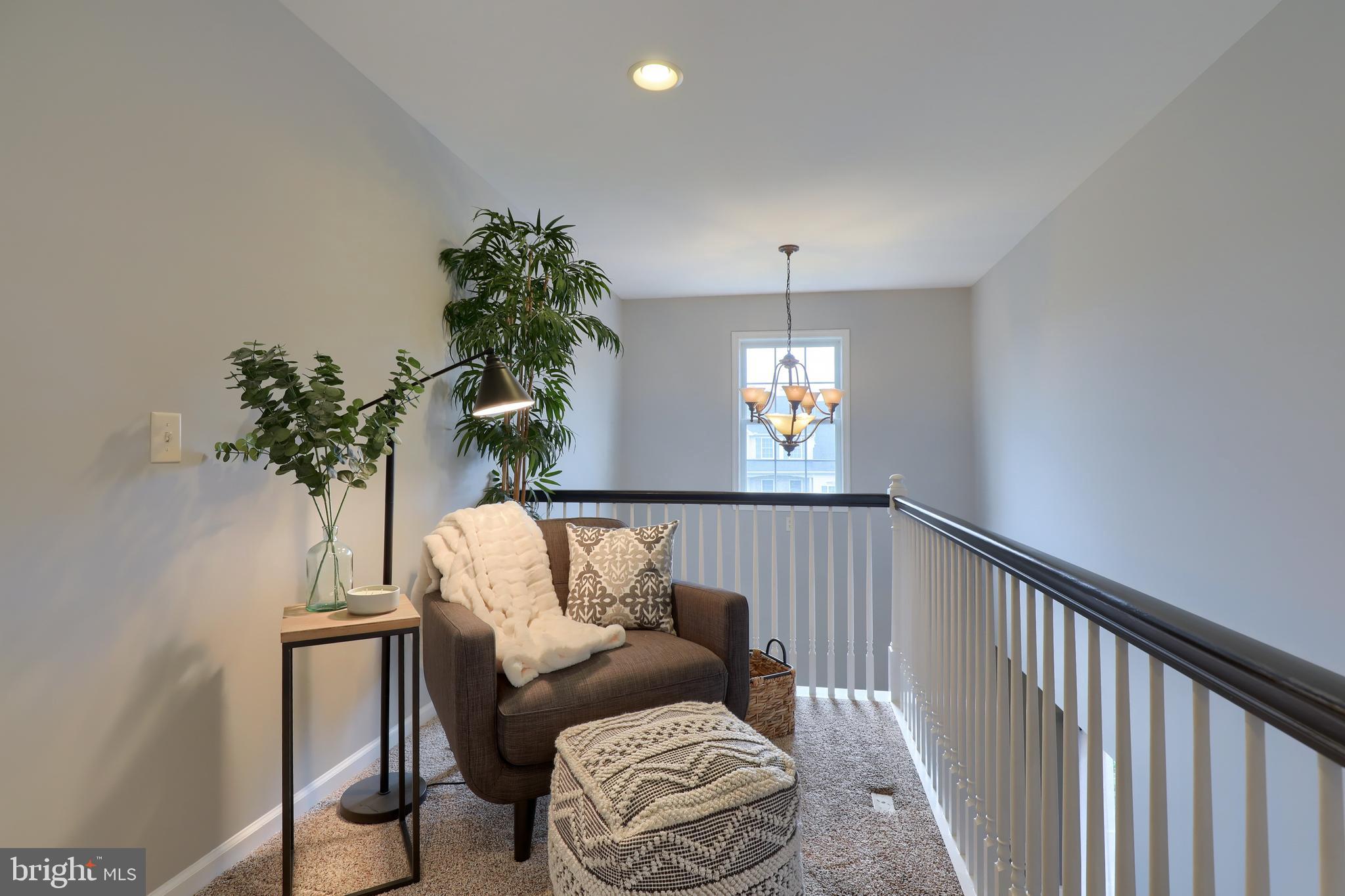 409 Wagonwheel Road Lititz, PA 17543 - Photo 25 of 40 a view of a livingroom with furniture and a potted plant