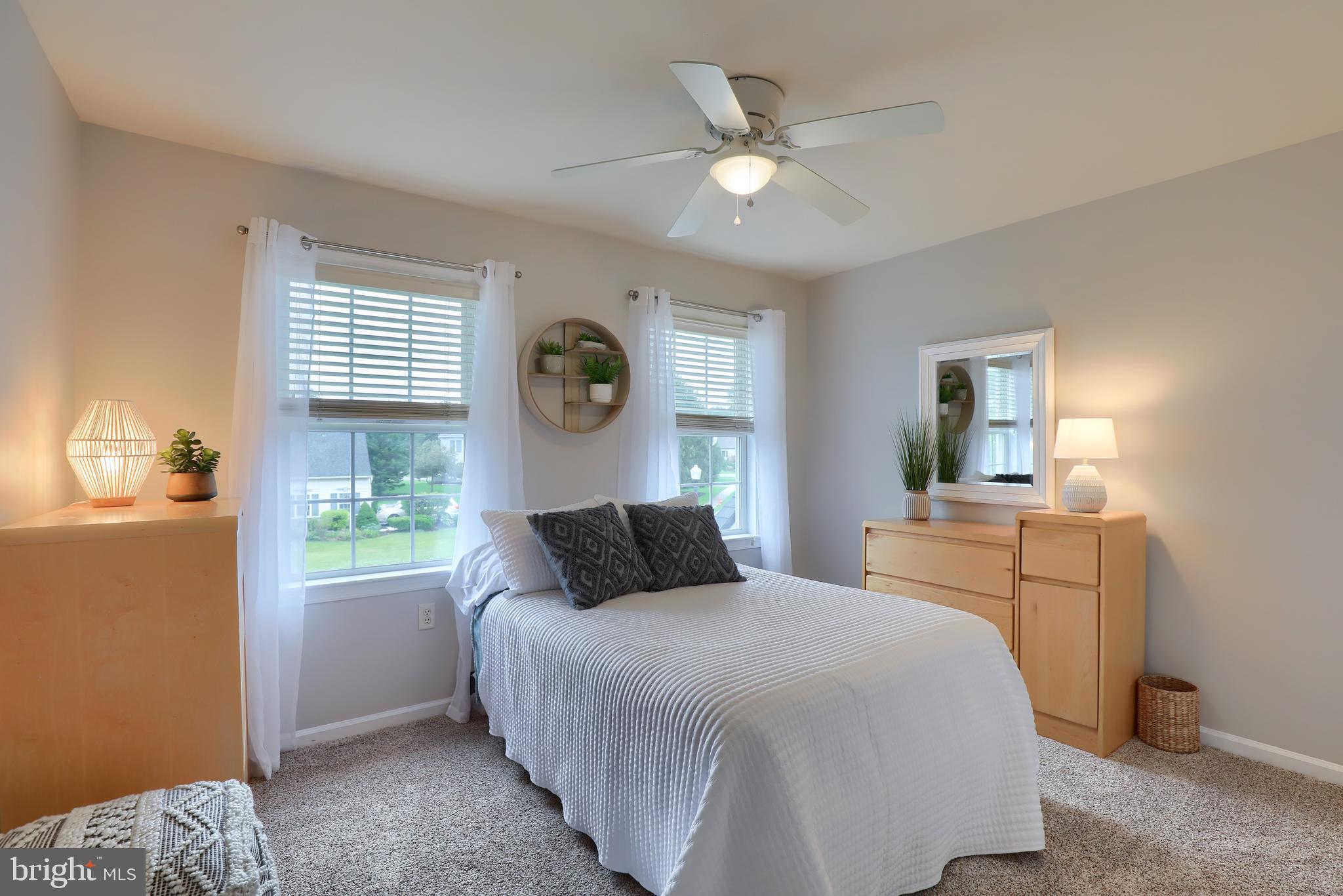 409 Wagonwheel Road Lititz, PA 17543 - Photo 32 of 40 a bedroom with a large bed and a window