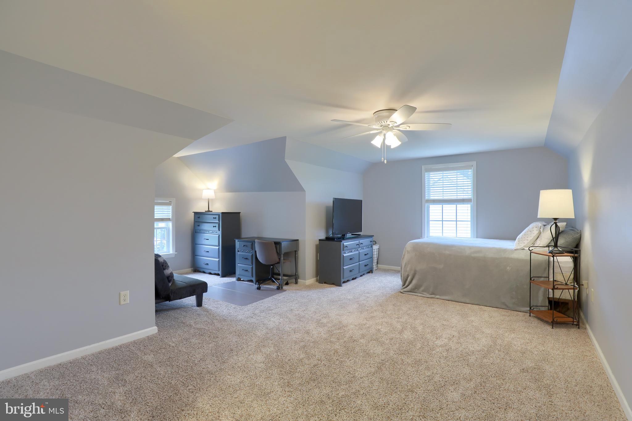 409 Wagonwheel Road Lititz, PA 17543 - Photo 33 of 40 a living room with furniture and a chandelier