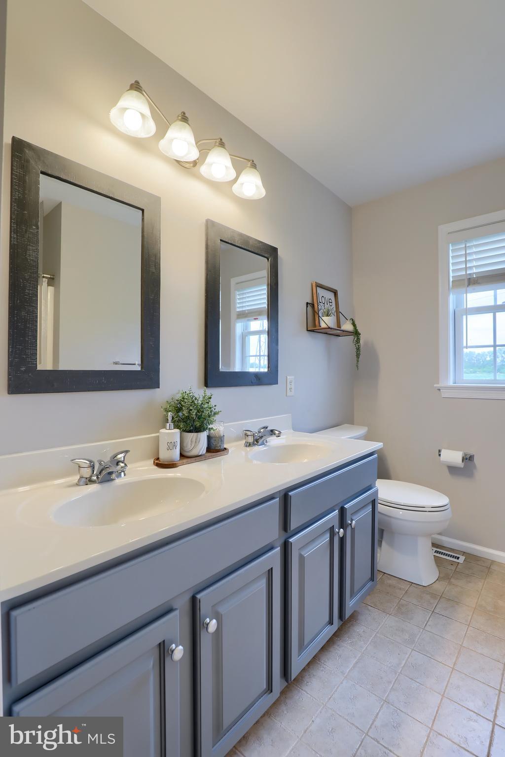 409 Wagonwheel Road Lititz, PA 17543 - Photo 35 of 40 a bathroom with a toilet sink and mirror