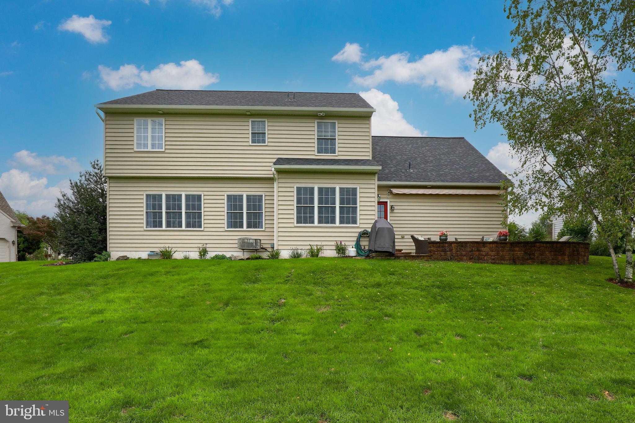 409 Wagonwheel Road Lititz, PA 17543 - Photo 39 of 40 a front view of a house with a garden