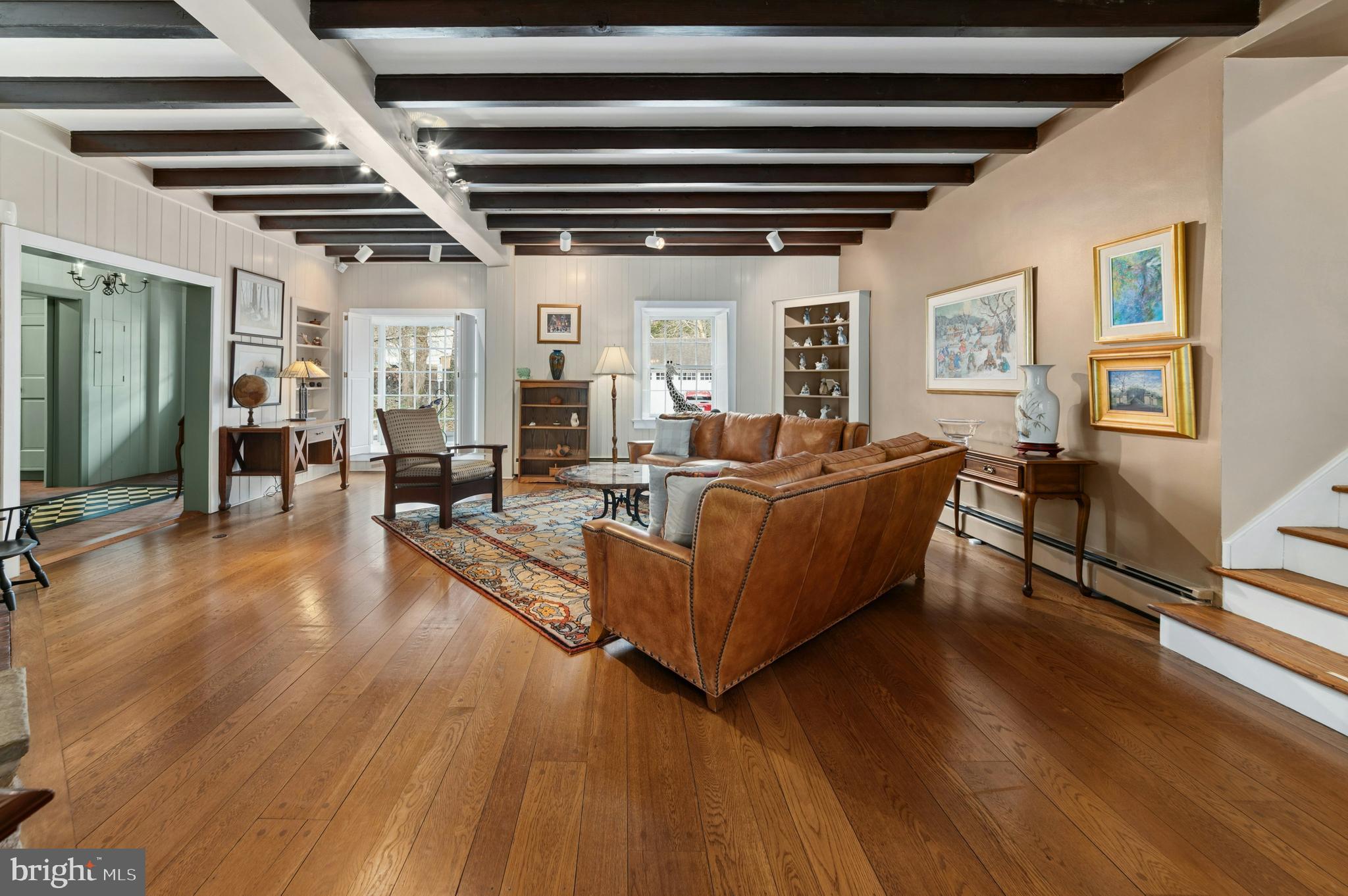 2885 Mill Road Doylestown, PA 18902 - Photo 12 of 50 a living room with furniture and a wooden floor