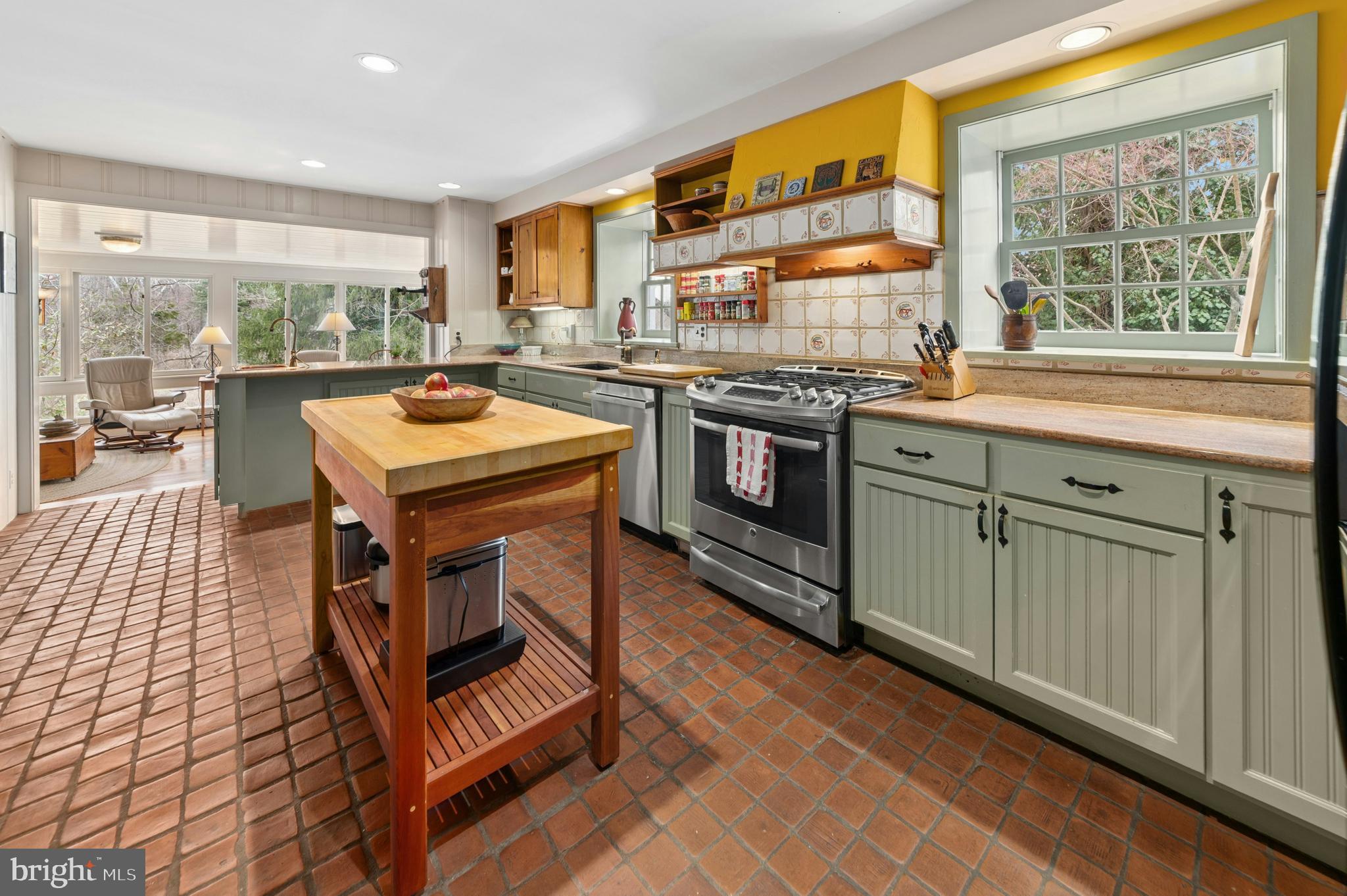 2885 Mill Road Doylestown, PA 18902 - Photo 16 of 50 a kitchen with a stove a sink and a wooden cabinets