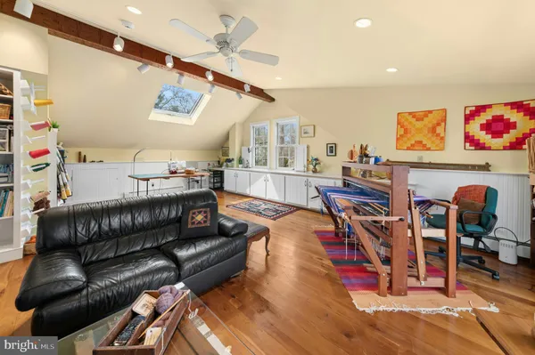 a kitchen with a table chairs sink and cabinets