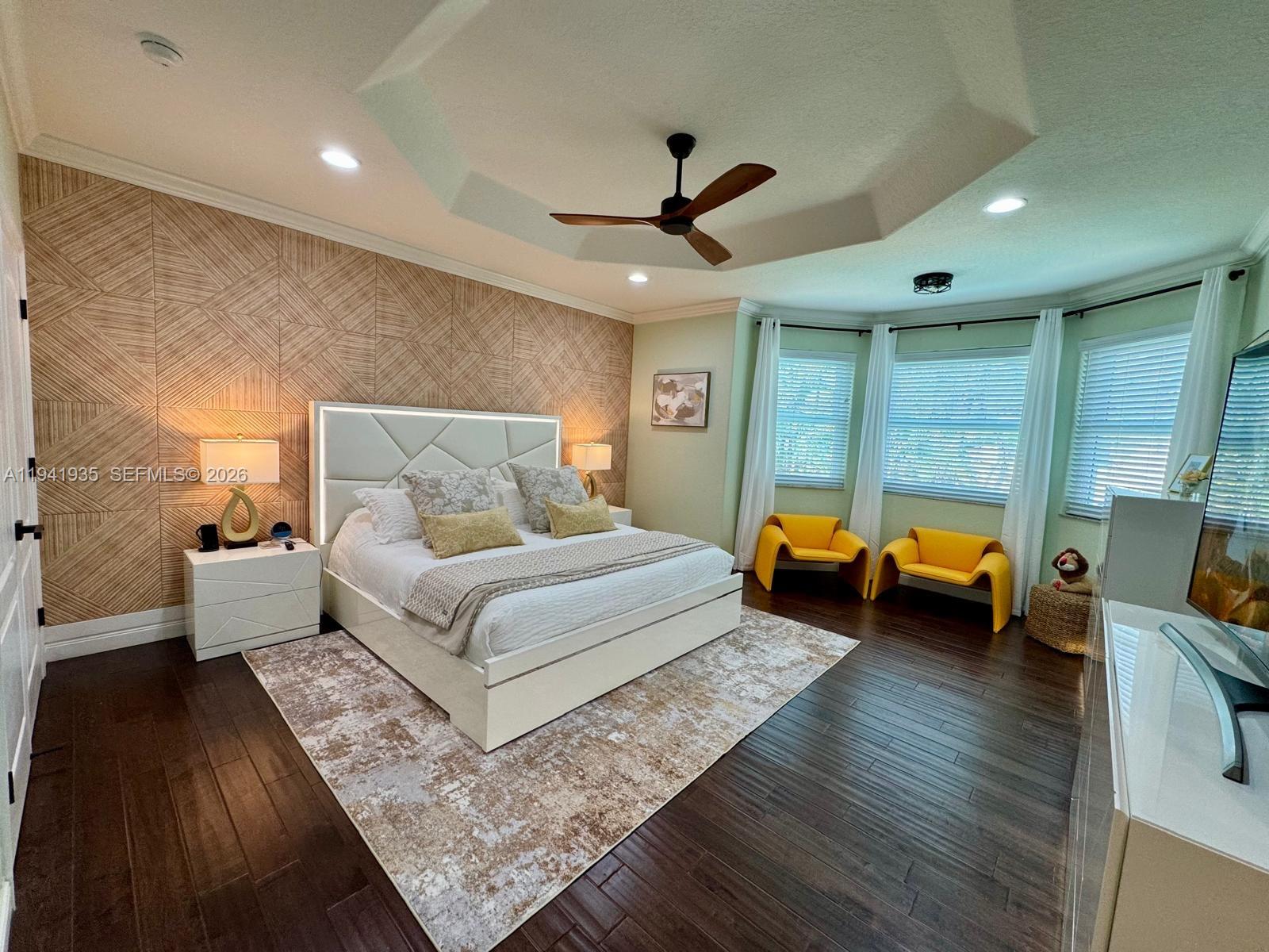 12917 Southwest 23rd Street Miramar, FL 33027 - Photo 13 of 47 a bedroom with furniture and a large window