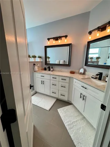 a kitchen with stainless steel appliances a sink stove and refrigerator