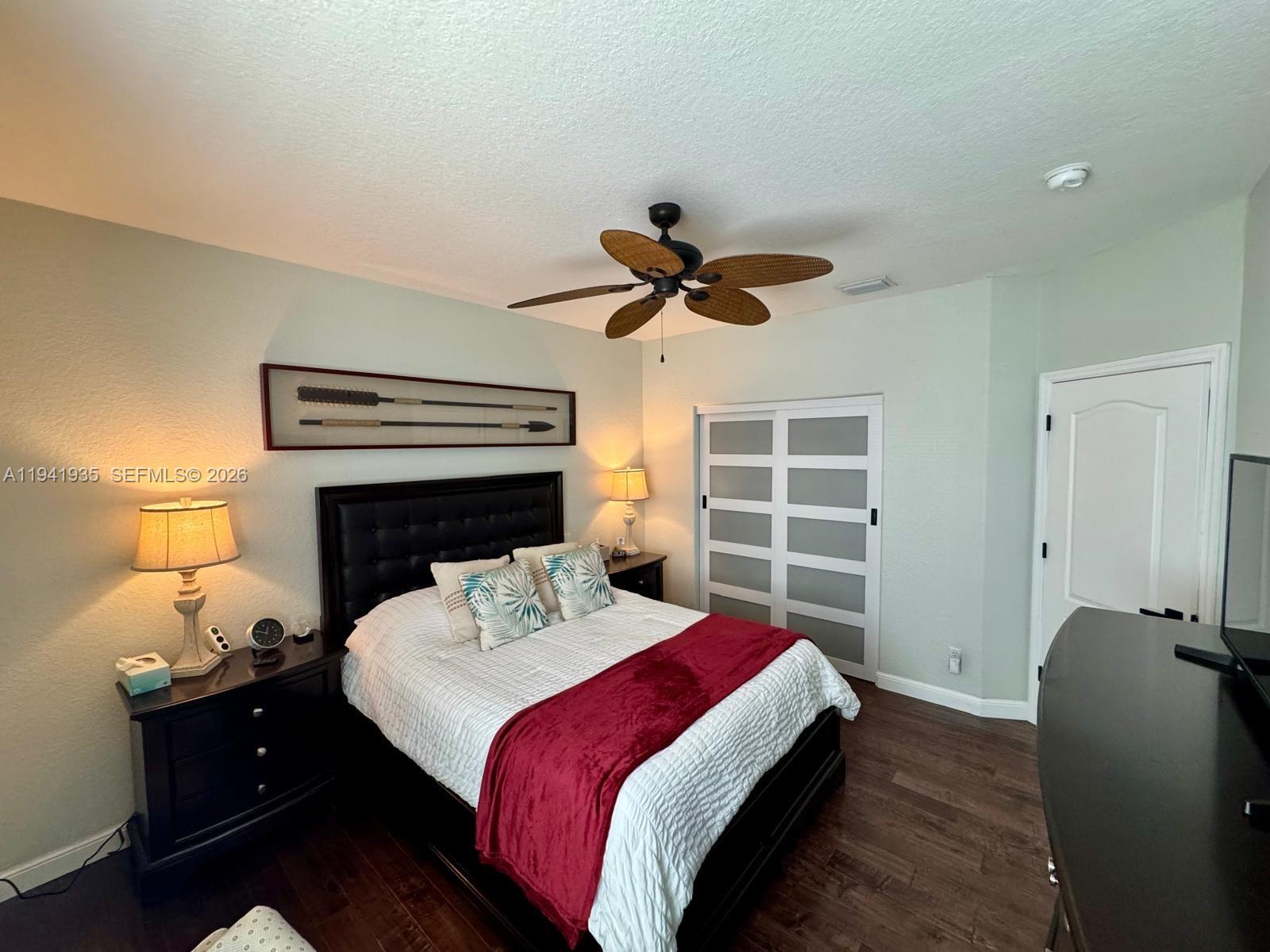 12917 Southwest 23rd Street Miramar, FL 33027 - Photo 28 of 47 a bed room with a bed and a window