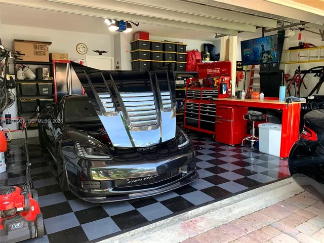 a room with lots of frames and chairs