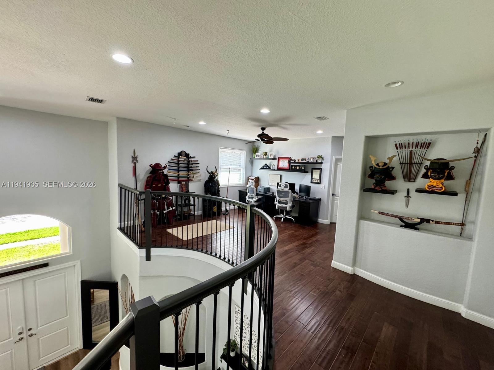 12917 Southwest 23rd Street Miramar, FL 33027 - Photo 37 of 47 a view of a dining room with furniture and wooden floor