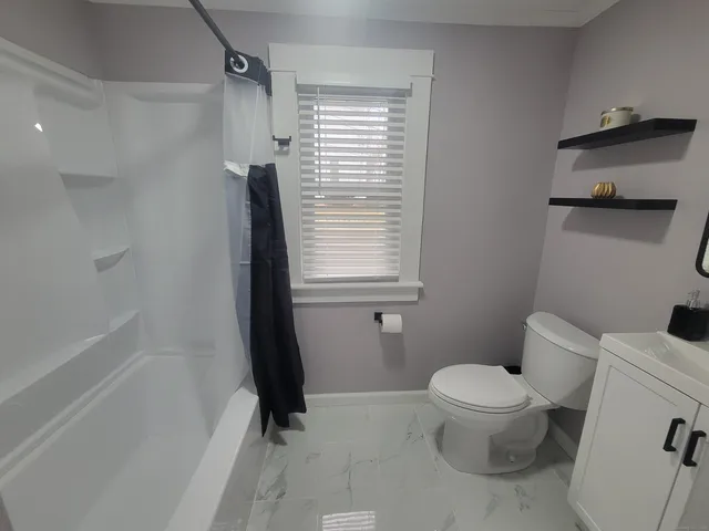 an empty room with wooden floor