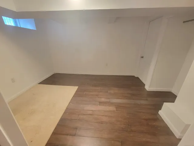 a view of house with a potted plant and a window