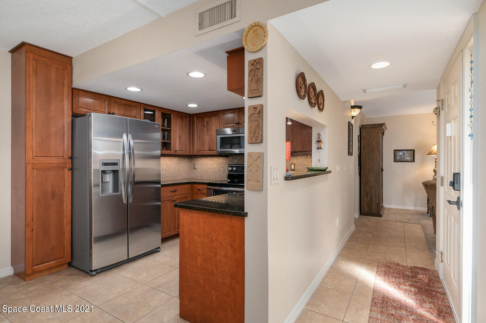 39 Piney Branch Way, Unit B Melbourne, FL 32904 - Photo 9 of 16 Kitchen and Entry