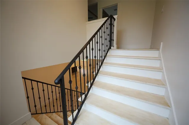 an entryway in a hall with a window