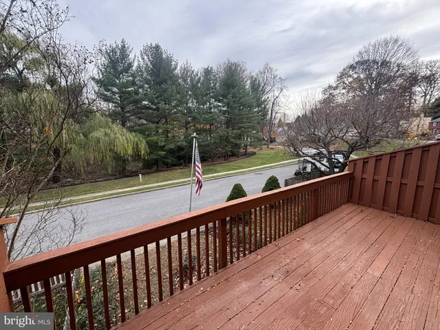 a view of deck with wooden floor and fence