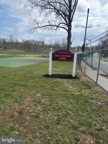 a view of a street with an outdoor space