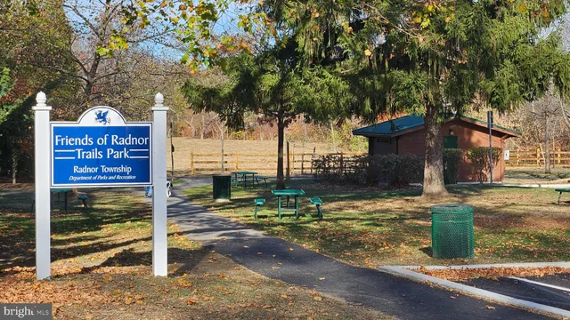a sign board on the side of a road