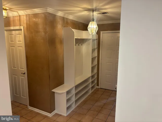 a bathroom with a shower and a glass door