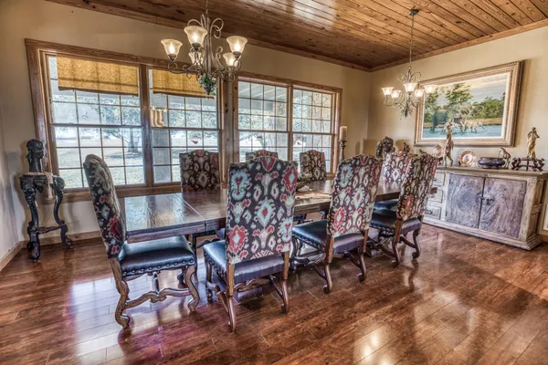 a view of a dining room with furniture window and outside view
